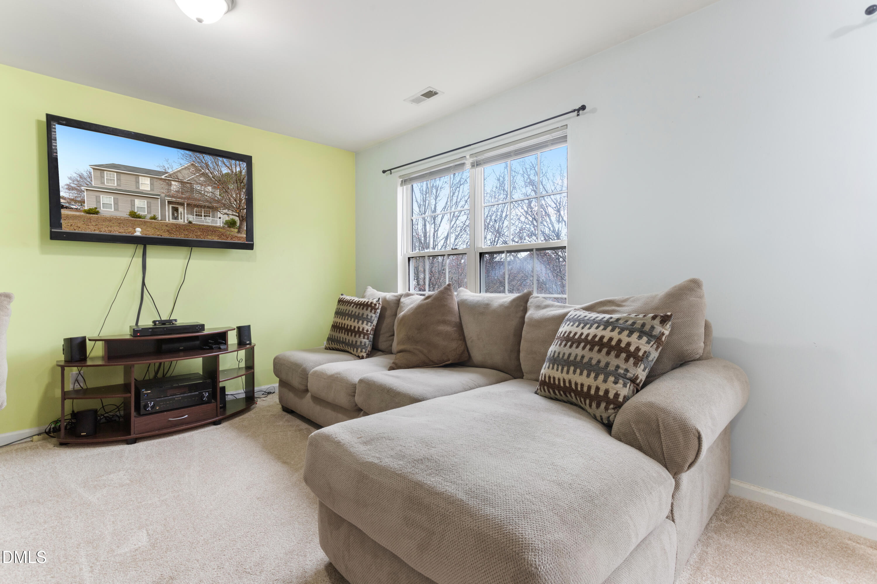 3101 Rendezvous Drive Raleigh, NC 27610 - Photo 21 of 39 a living room with furniture a couch and a window