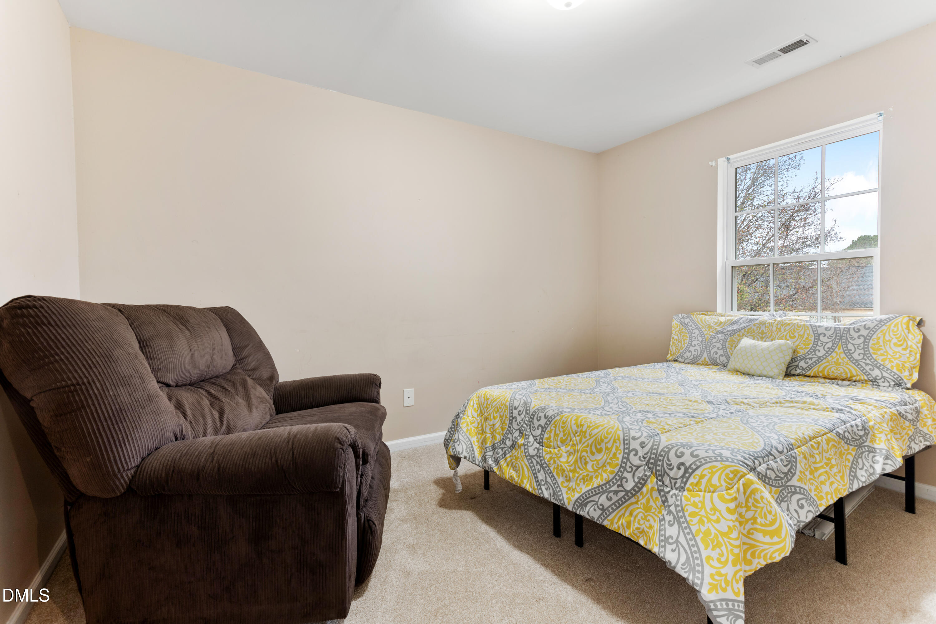 3101 Rendezvous Drive Raleigh, NC 27610 - Photo 24 of 39 a bedroom with a bed and window