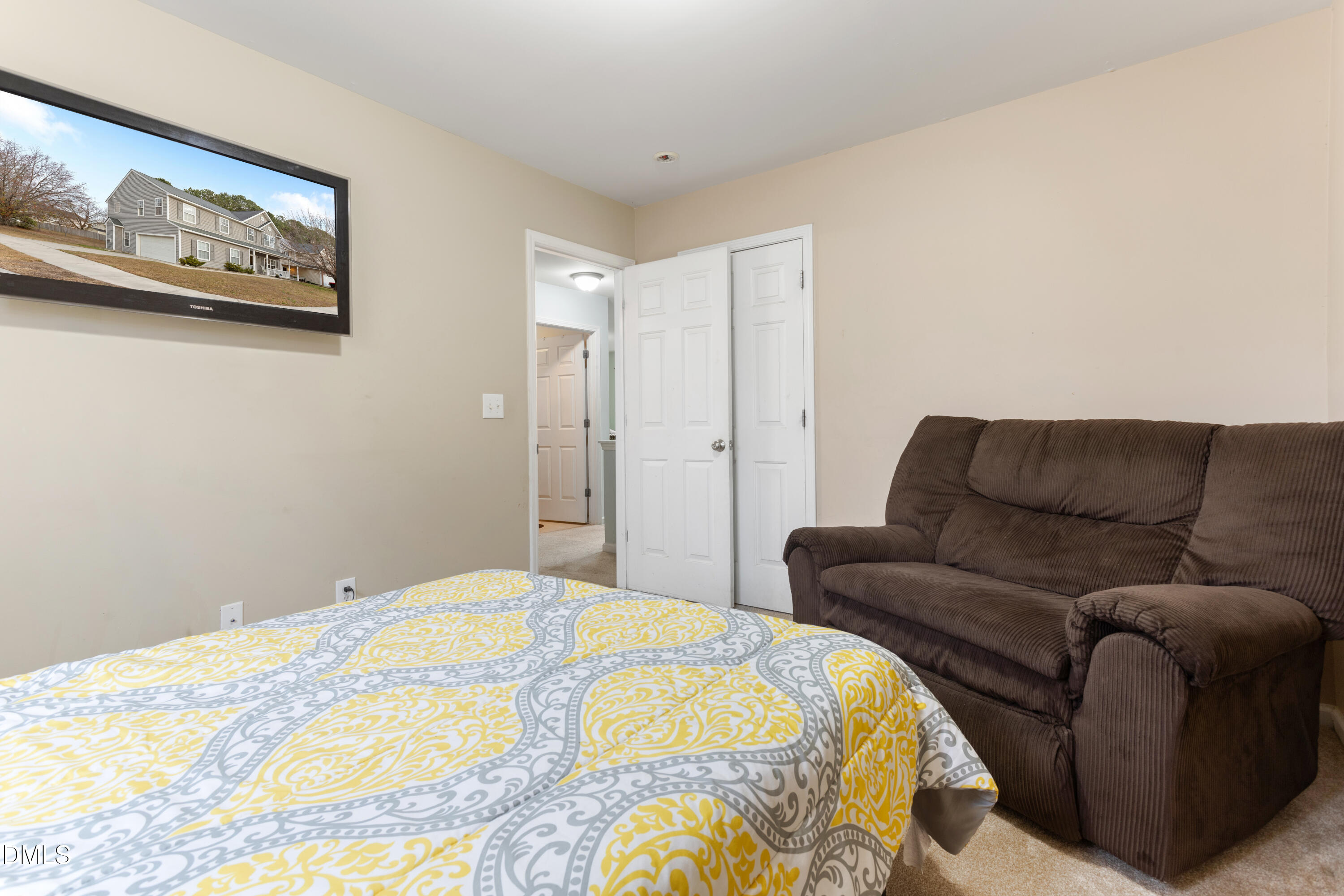 3101 Rendezvous Drive Raleigh, NC 27610 - Photo 25 of 39 a bedroom with a bed and painting on the wall