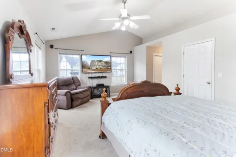a bedroom with a bed and window