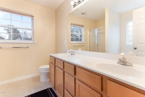 a bedroom with bed and window