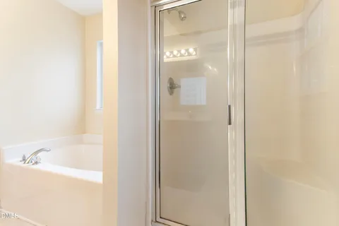 a bathroom with a sink toilet and window