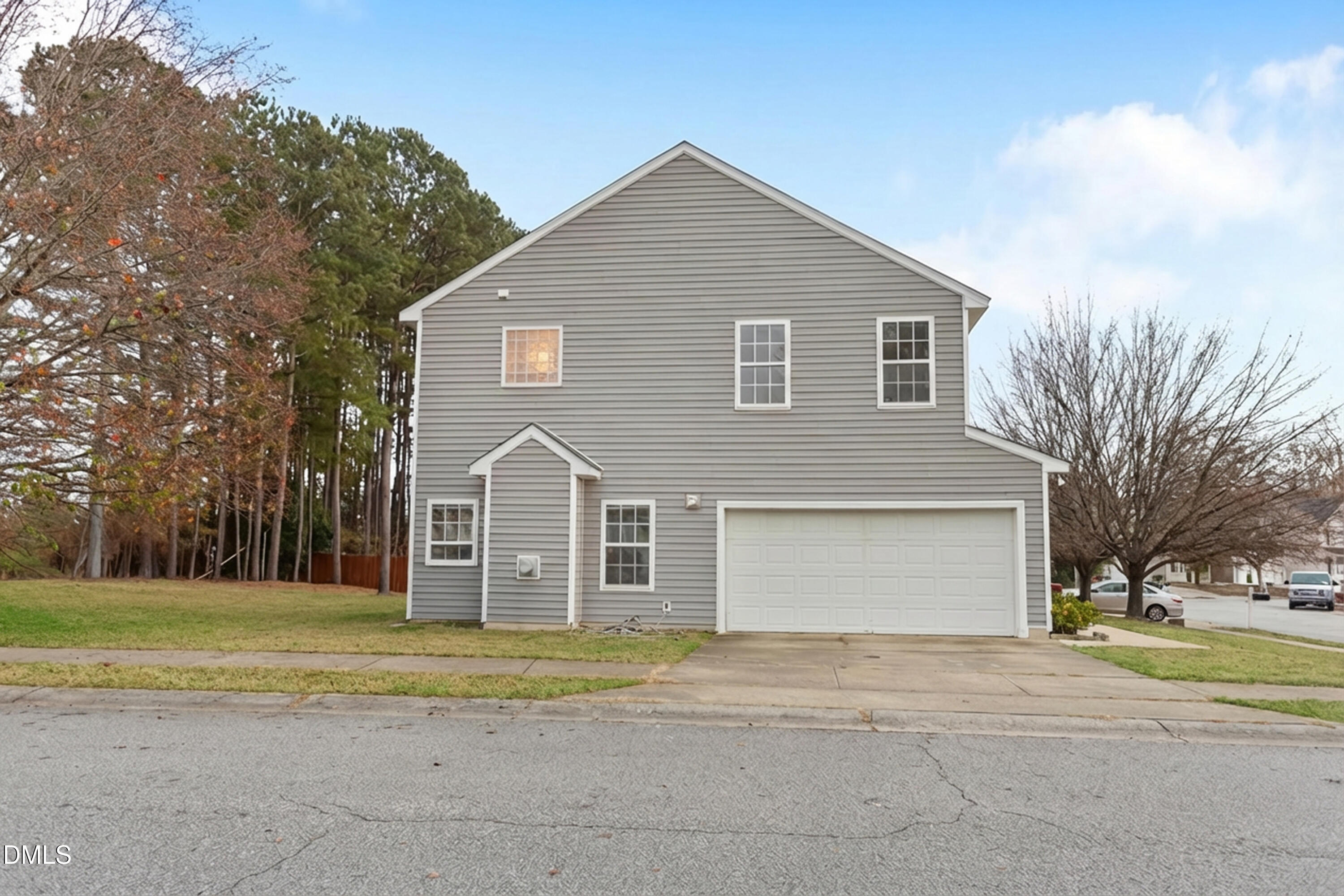 3101 Rendezvous Drive Raleigh, NC 27610 - Photo 3 of 39 a front view of a house with a yard and garage