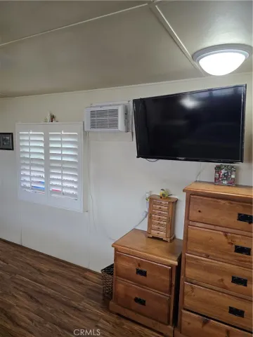 a room with furniture and a flat screen tv