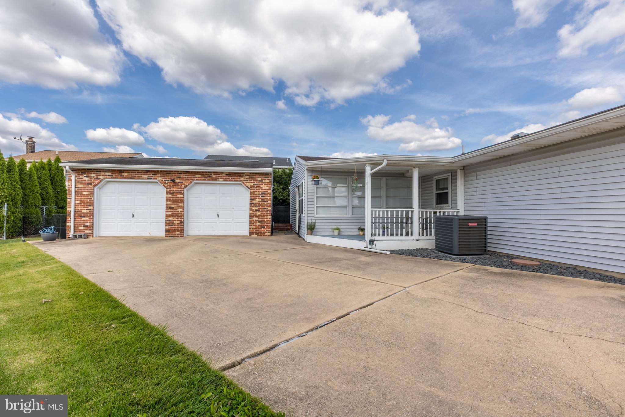 4 Reyburn Court New Castle, DE 19720 - Photo 2 of 21 a view of a house with a yard and garage