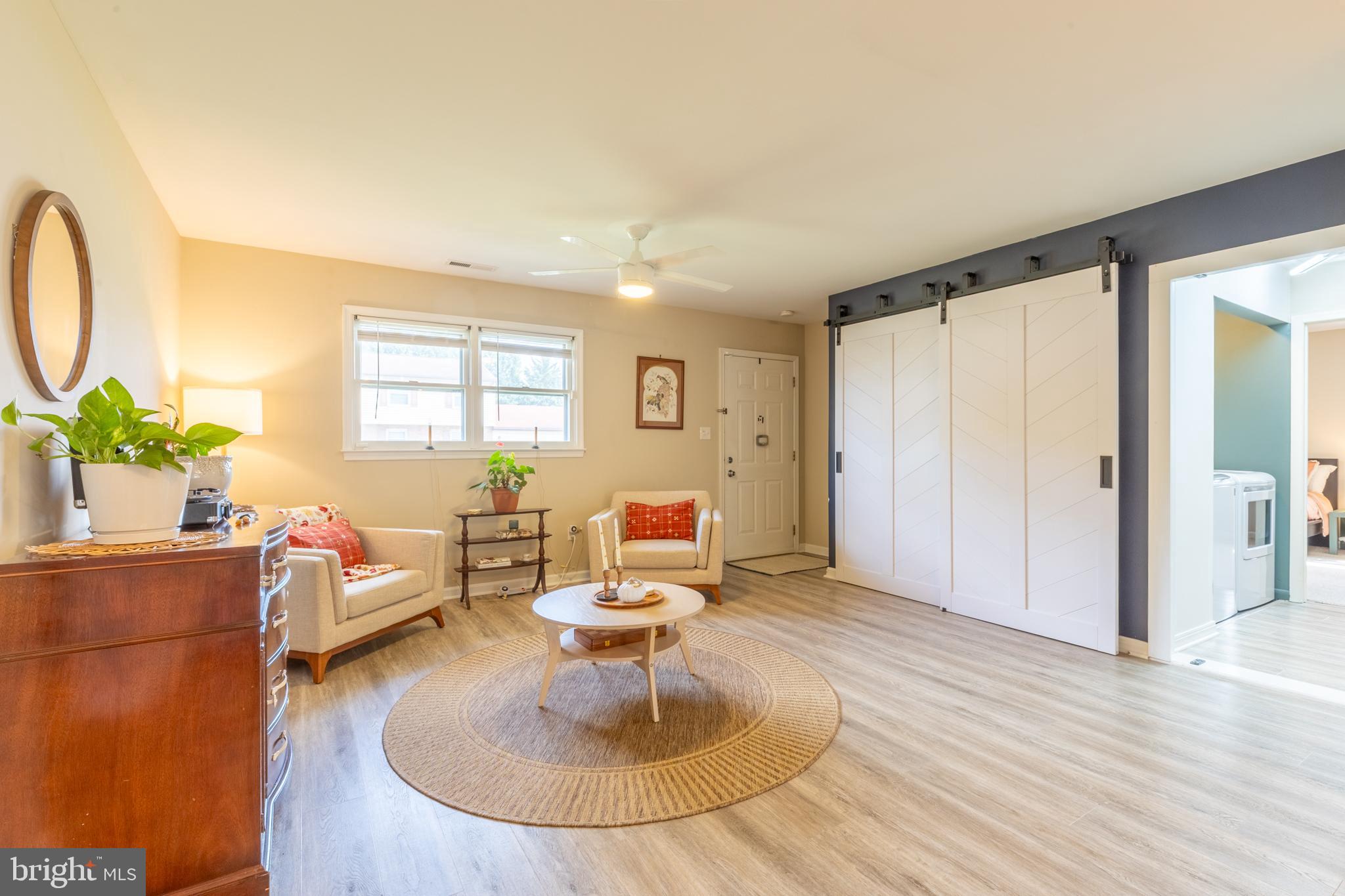 4 Reyburn Court New Castle, DE 19720 - Photo 4 of 21 a living room with furniture a fireplace and a table