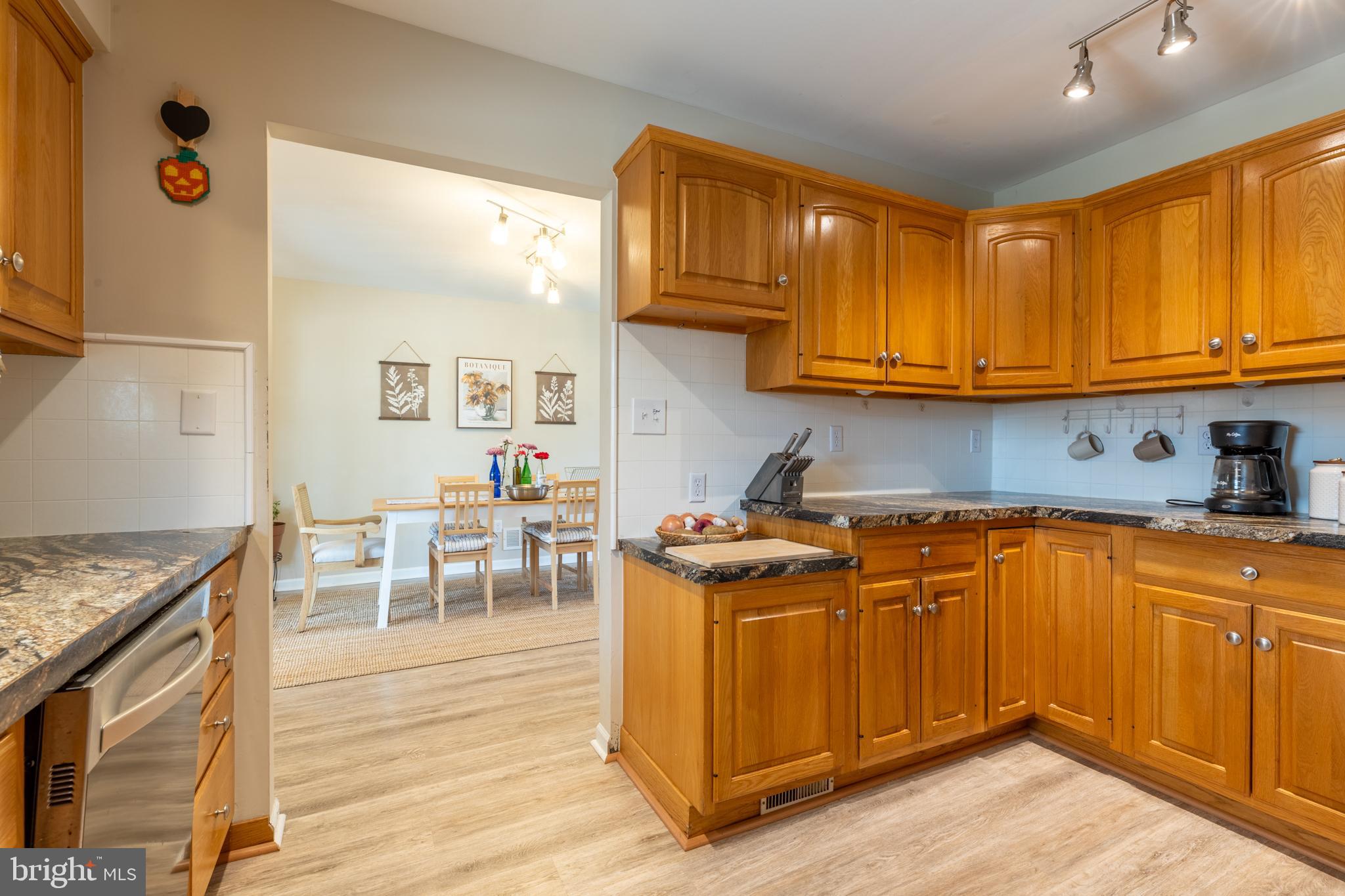 4 Reyburn Court New Castle, DE 19720 - Photo 9 of 21 a kitchen with stainless steel appliances granite countertop sink stove top oven and cabinets