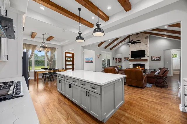 a view of living room with furniture and a flat screen tv