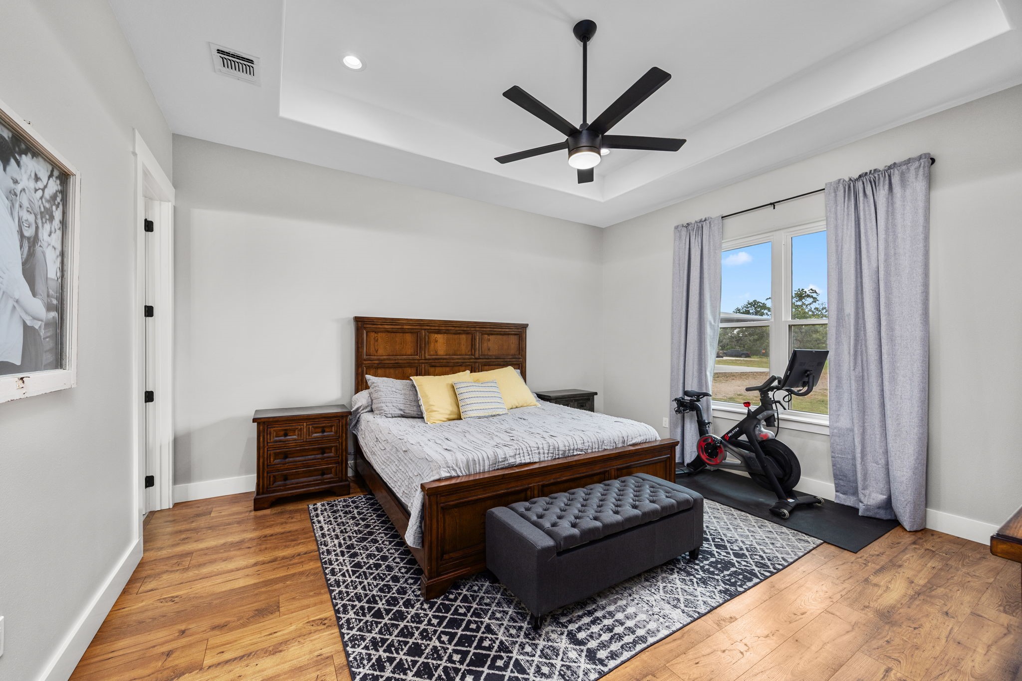 1507 Smith Rau Road Columbus, TX 78934 - Photo 17 of 50 a bedroom with a bed rug and wooden floor