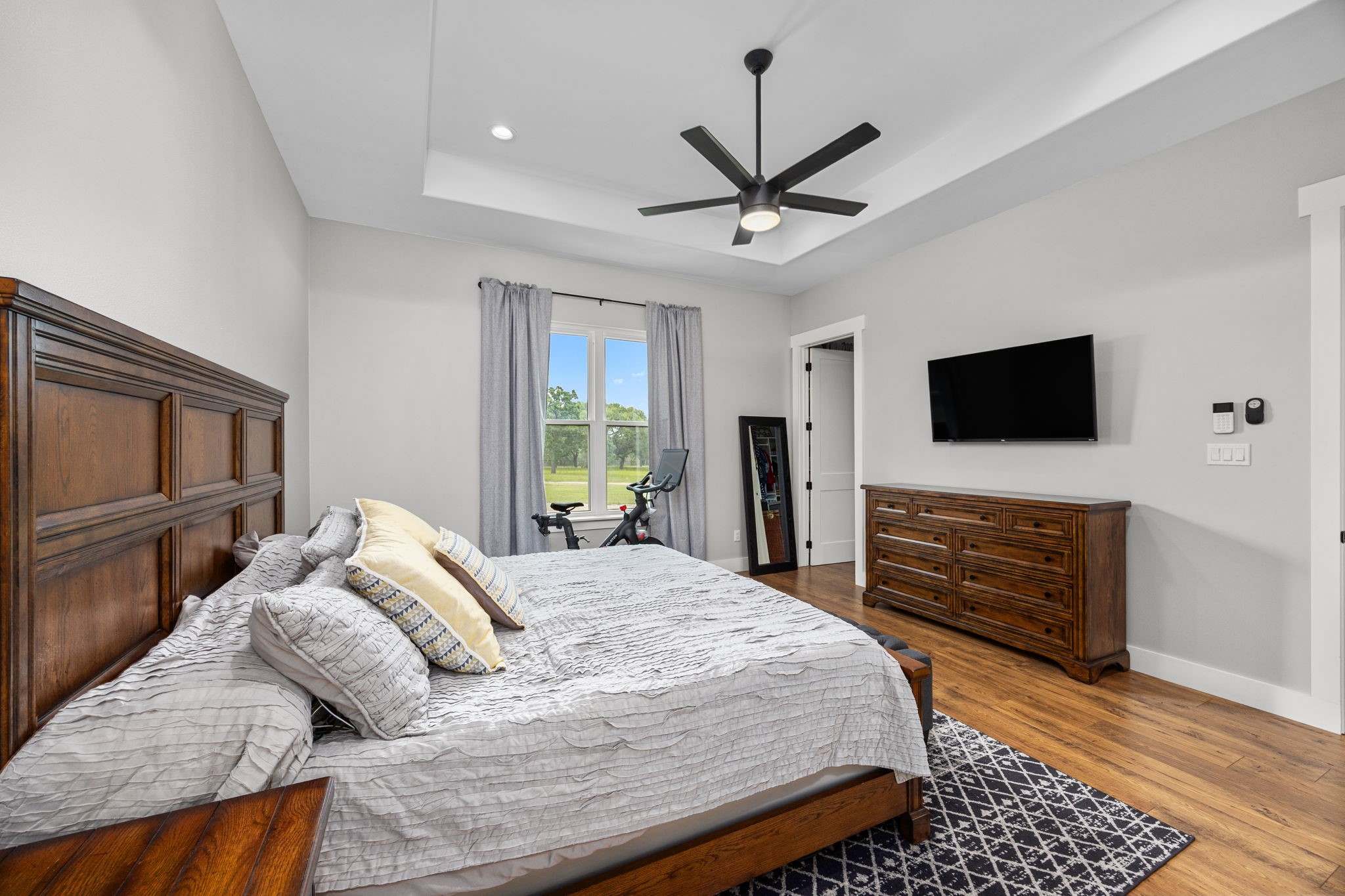 1507 Smith Rau Road Columbus, TX 78934 - Photo 18 of 50 a bedroom with a bed and a flat screen tv