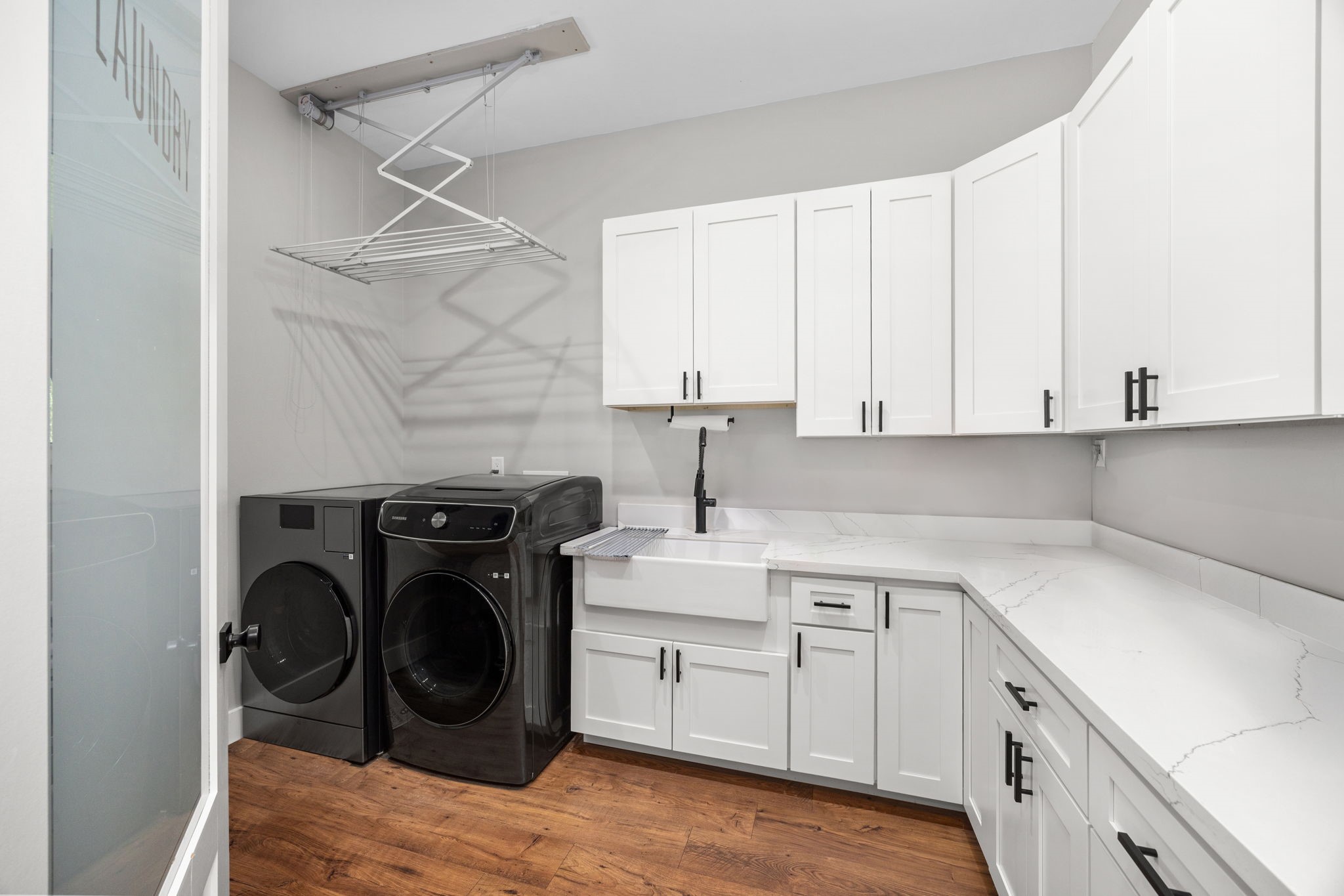 1507 Smith Rau Road Columbus, TX 78934 - Photo 24 of 50 a utility room with cabinets washer and dryer