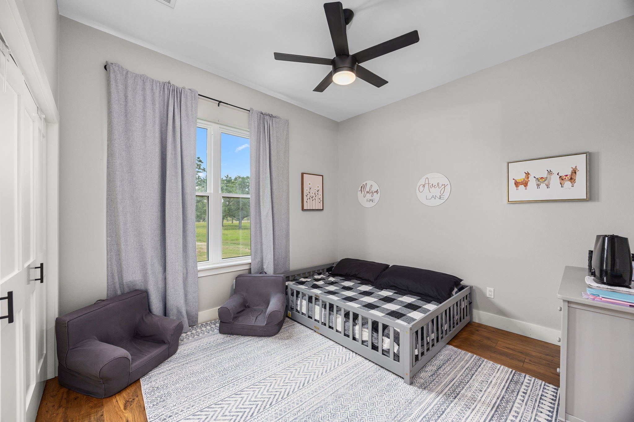 1507 Smith Rau Road Columbus, TX 78934 - Photo 30 of 50 a spacious bedroom with a bed a couch and a window