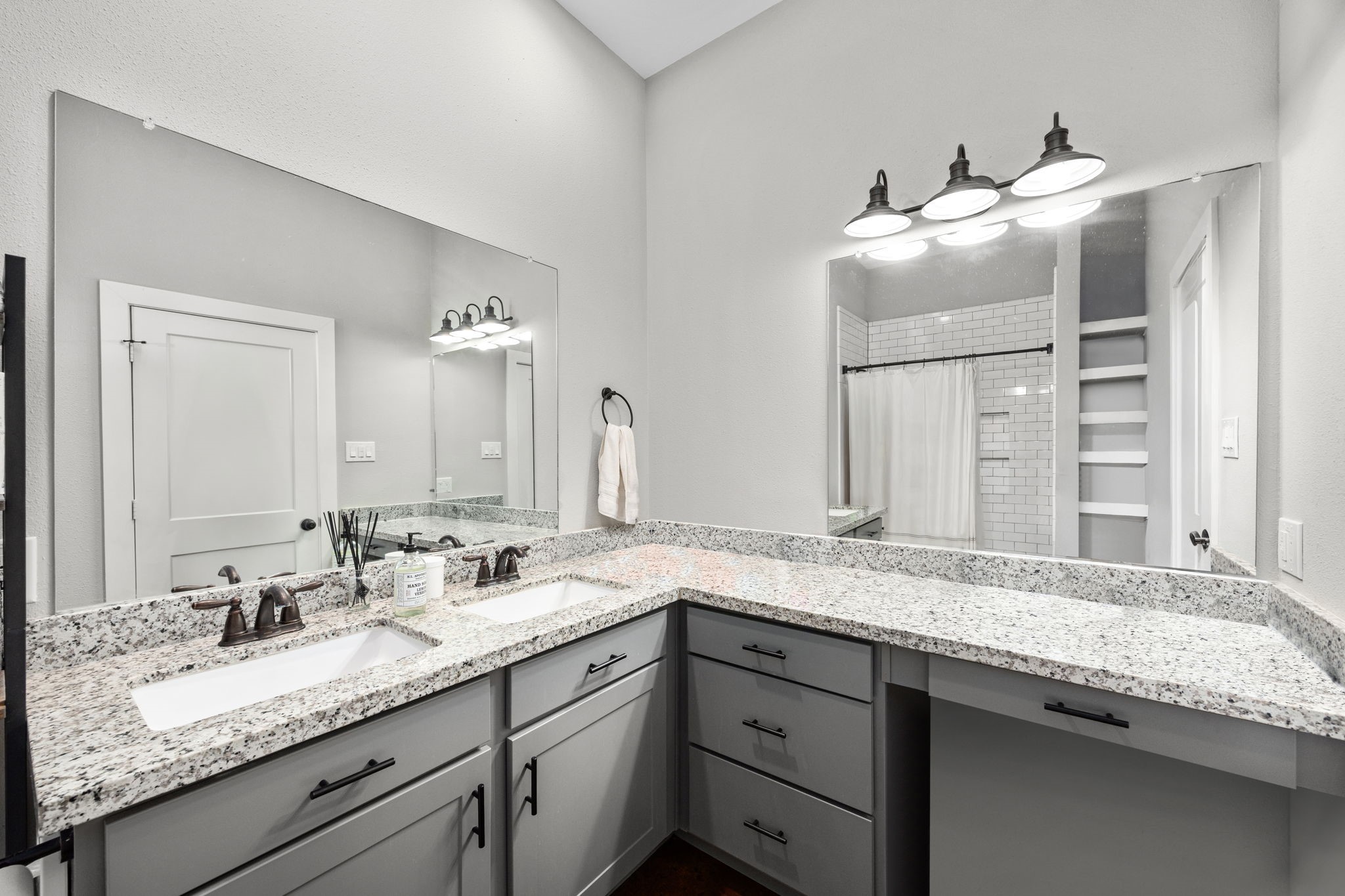 1507 Smith Rau Road Columbus, TX 78934 - Photo 33 of 50 a bathroom with a granite countertop double vanity sink and mirror