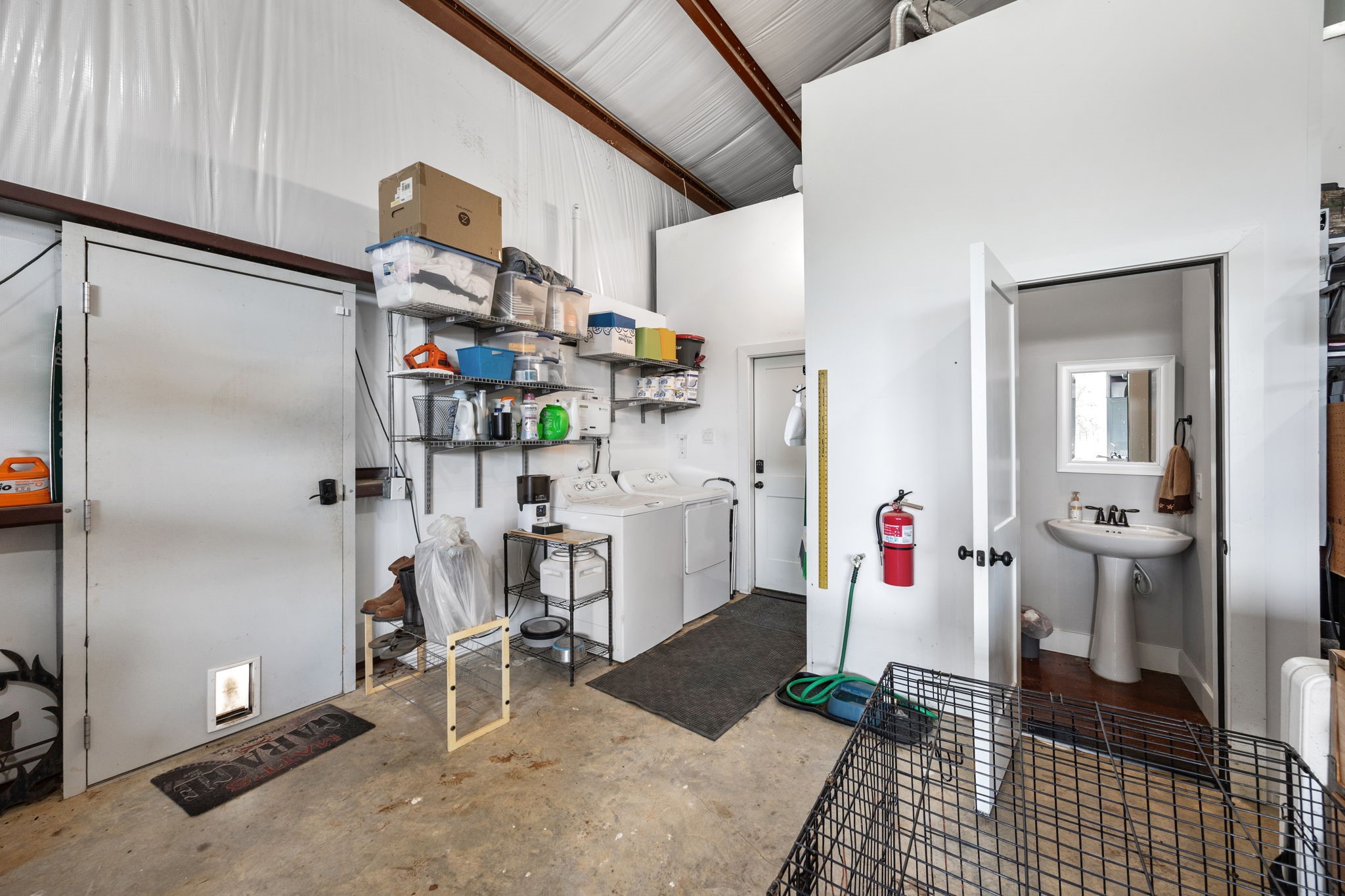 1507 Smith Rau Road Columbus, TX 78934 - Photo 34 of 50 a room with furniture a mirror and gym equipment