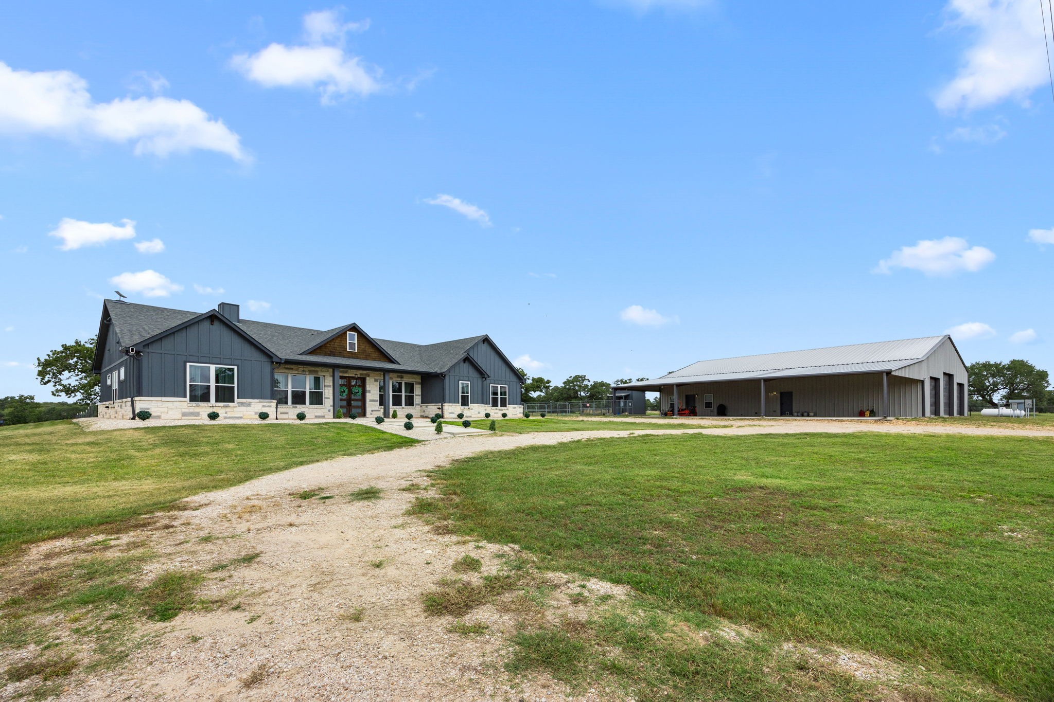 1507 Smith Rau Road Columbus, TX 78934 - Photo 4 of 50 a front view of a house with a yard