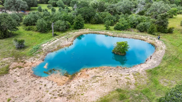 a view of a swimming pool with a yard