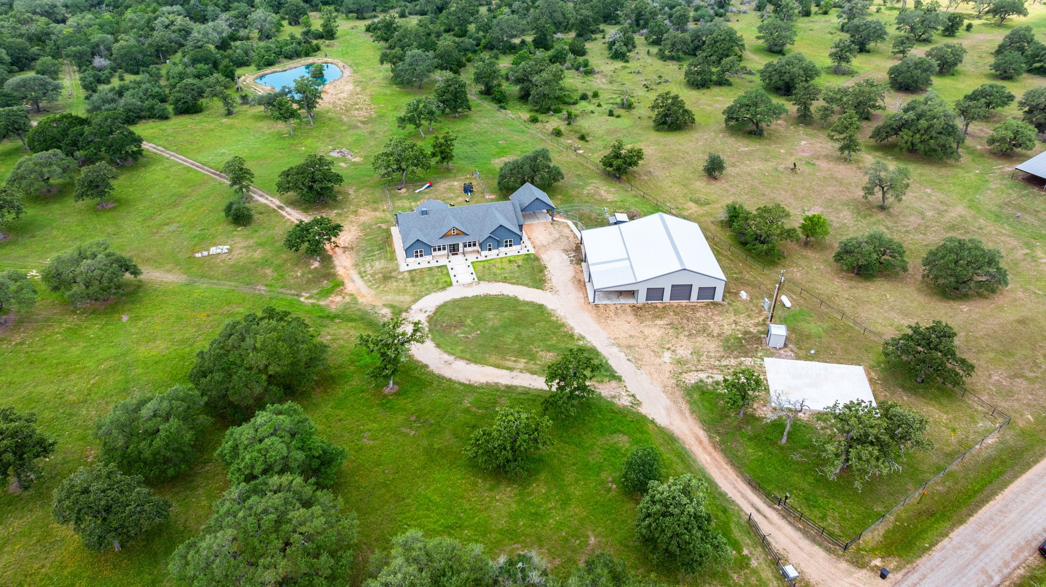 1507 Smith Rau Road Columbus, TX 78934 - Photo 48 of 50 an aerial view of residential house with outdoor space and trees all around