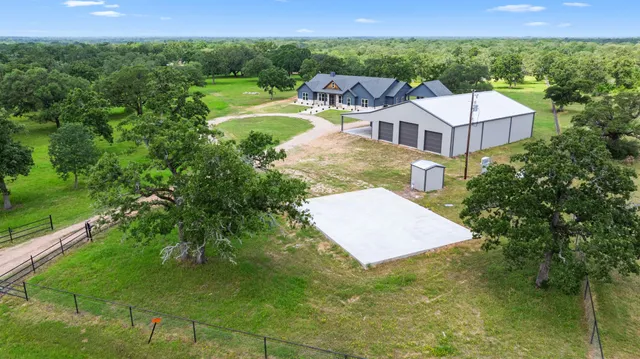 a aerial view of a house with a yard