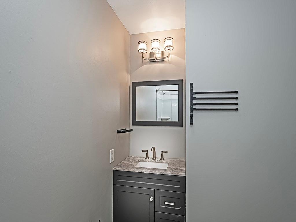 516 South Eberhart Road Butler, PA 16001 - Photo 16 of 31 a bathroom with a sink and a mirror