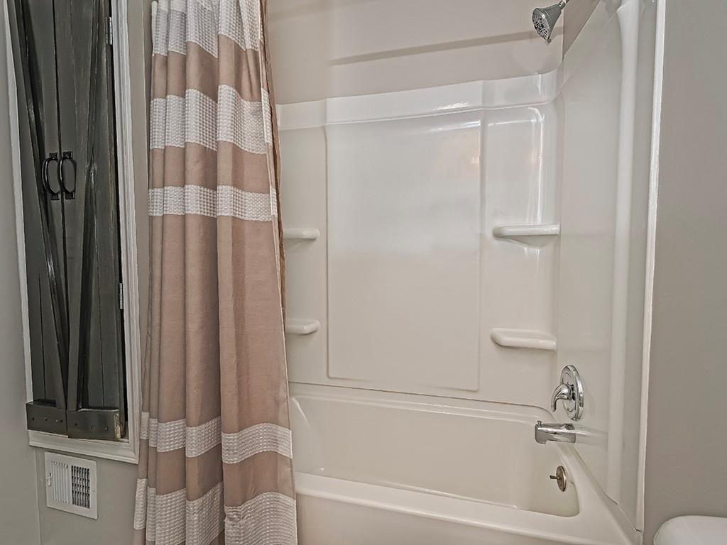 516 South Eberhart Road Butler, PA 16001 - Photo 17 of 31 a bathroom with a bathtub and a shower