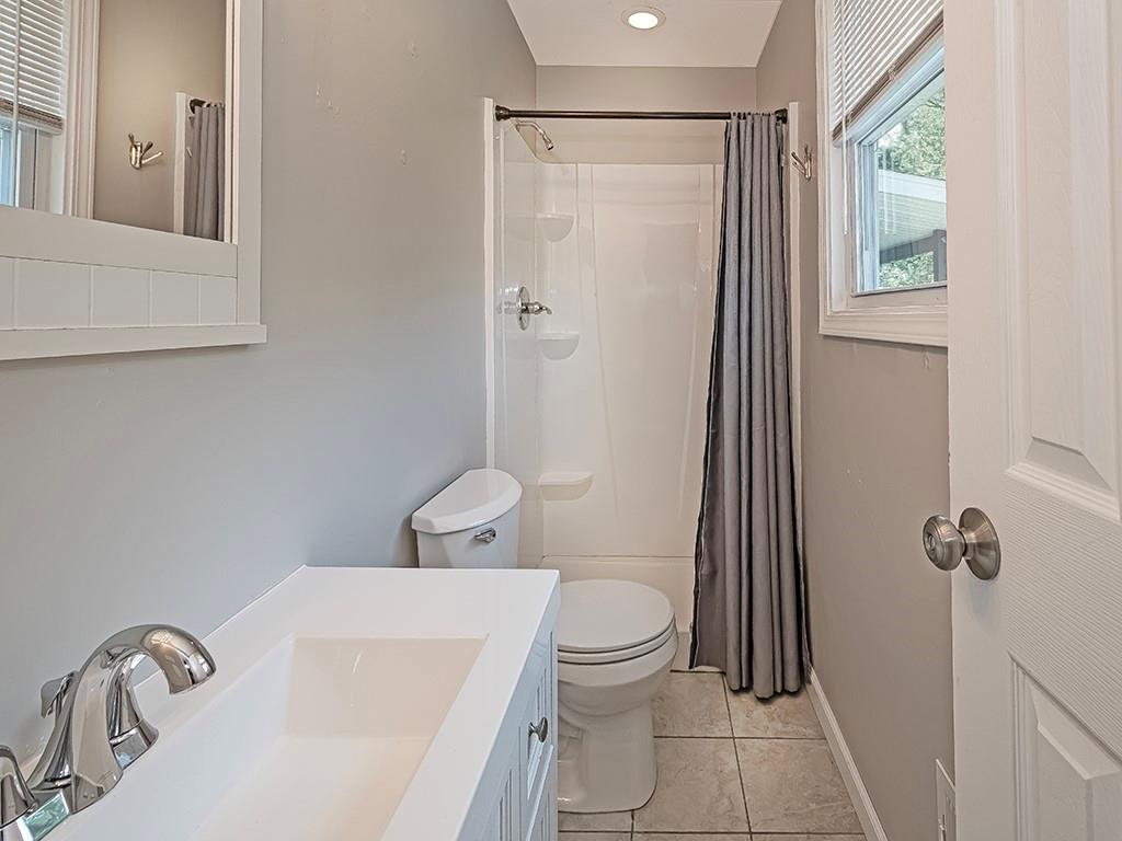 516 South Eberhart Road Butler, PA 16001 - Photo 20 of 31 a white toilet sitting next to a bathroom sink