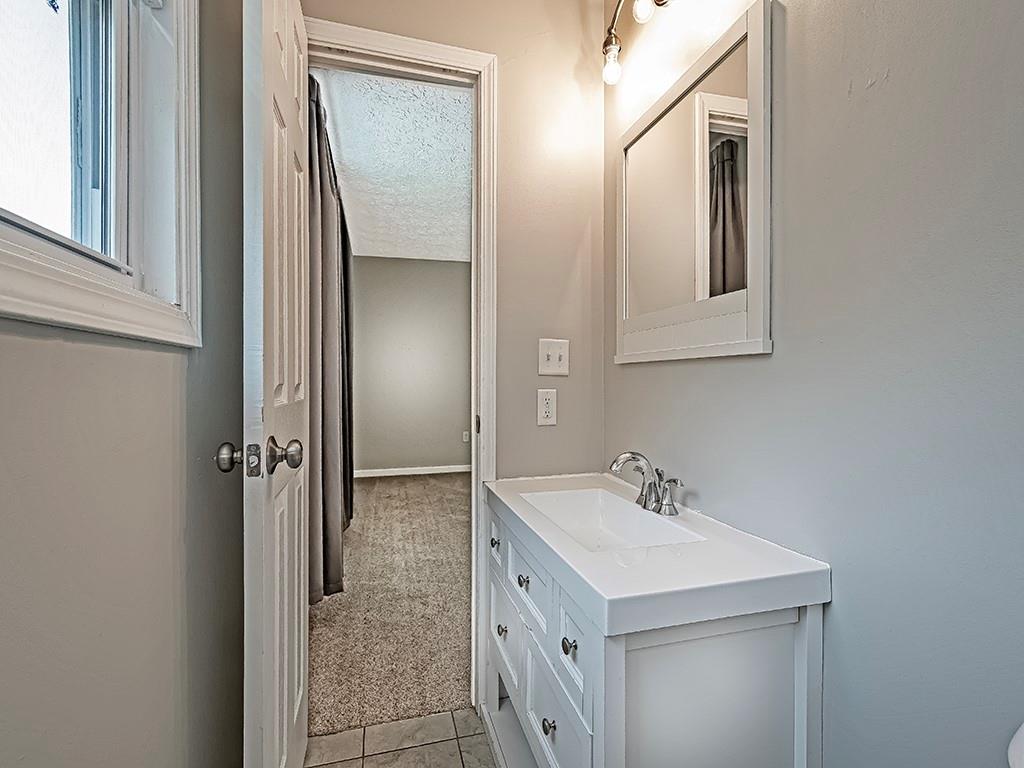 516 South Eberhart Road Butler, PA 16001 - Photo 21 of 31 a bathroom with a sink a mirror and a shower