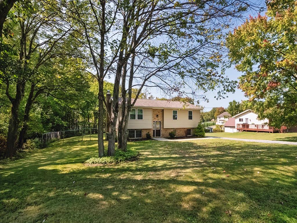 516 South Eberhart Road Butler, PA 16001 - Photo 28 of 31 a view of a house with a big yard and large trees