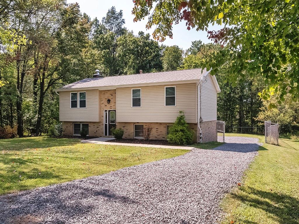 516 South Eberhart Road Butler, PA 16001 - Photo 30 of 31 a view of a house with a yard and large tree