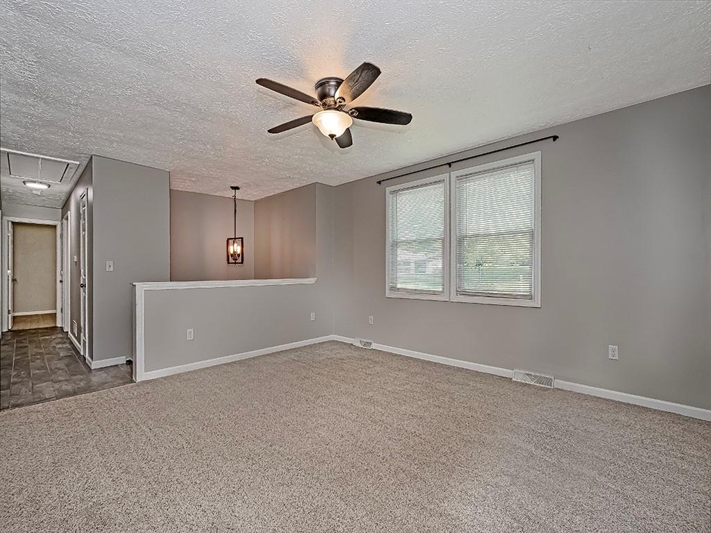 516 South Eberhart Road Butler, PA 16001 - Photo 6 of 31 a view of a livingroom with a ceiling fan and window