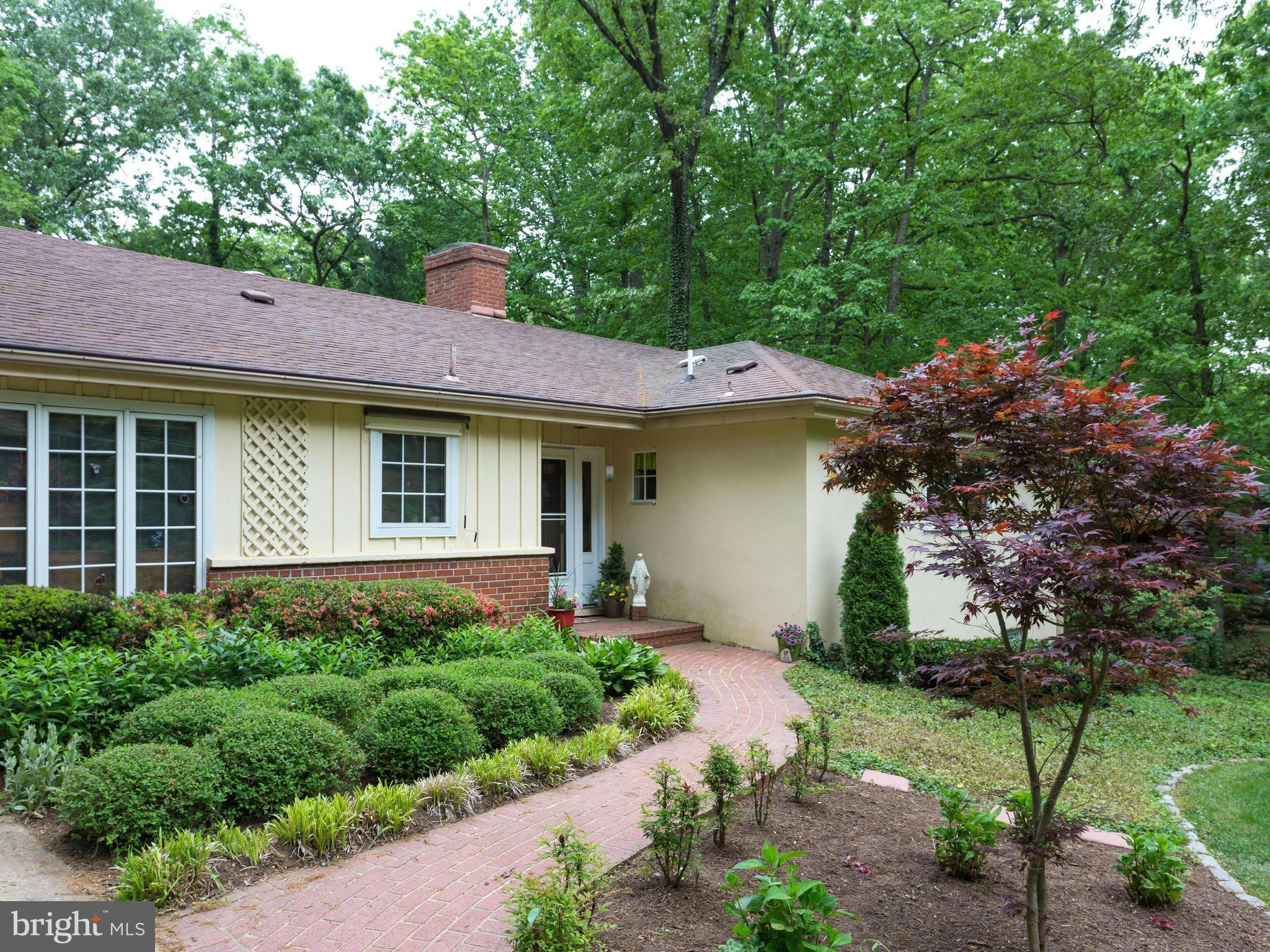 6609 Robin Road Springfield, VA 22150 - Photo 1 of 28 a front view of a house with a yard