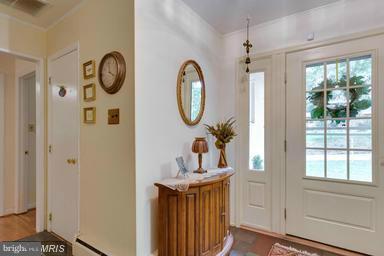 6609 Robin Road Springfield, VA 22150 - Photo 2 of 28 a bathroom with a toilet a sink and a mirror