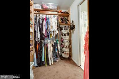 6609 Robin Road Springfield, VA 22150 - Photo 15 of 28 a view of walk in closet with clothes