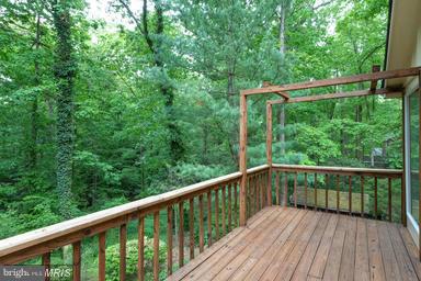 6609 Robin Road Springfield, VA 22150 - Photo 16 of 28 a balcony with wooden floor in outdoor space