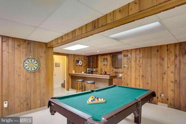 6609 Robin Road Springfield, VA 22150 - Photo 18 of 28 a room with pool table and a refrigerator