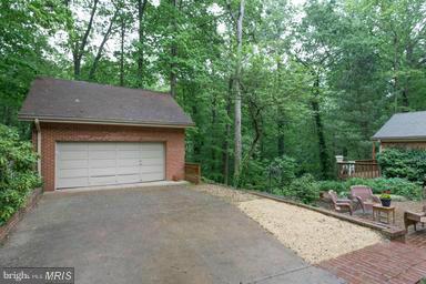 6609 Robin Road Springfield, VA 22150 - Photo 25 of 28 a house with trees in the background
