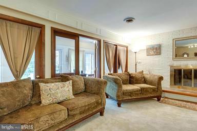 6609 Robin Road Springfield, VA 22150 - Photo 6 of 28 a living room with furniture and a large window