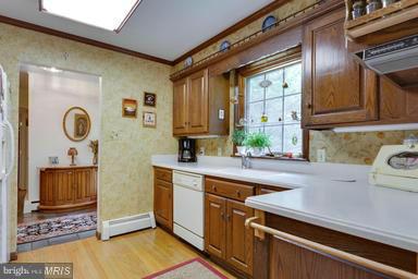 6609 Robin Road Springfield, VA 22150 - Photo 8 of 28 a kitchen with a sink cabinets and window