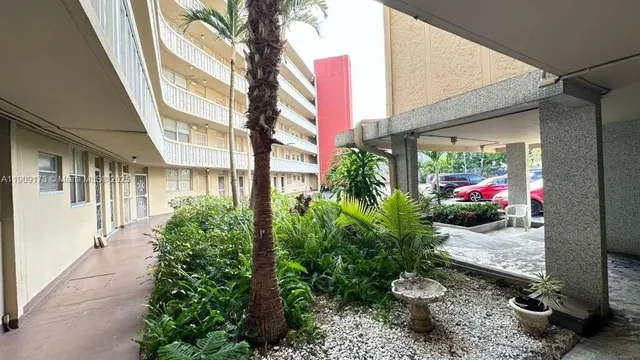 a view of balcony with wooden floor and fence