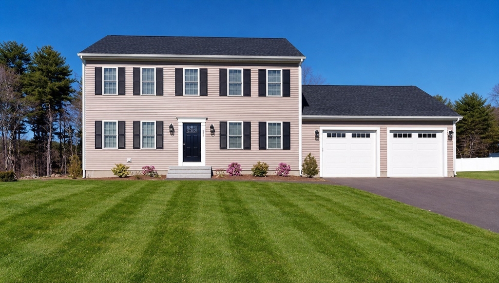 287 Wareham Street Middleboro, MA 02346 - Photo 2 of 28 a front view of a house with a yard