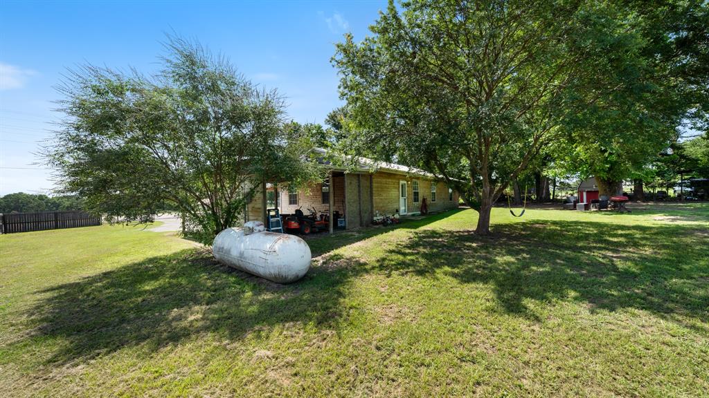 29080 Highway 19 Athens, TX 75752 - Photo 20 of 30 a backyard of a house with table and chairs