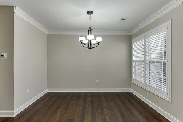a room with window and wooden floor