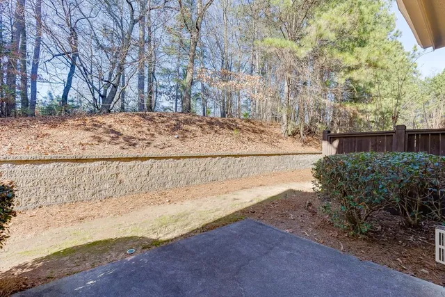 a view of a yard with trees