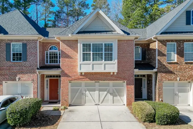 a front view of a house with glass doors