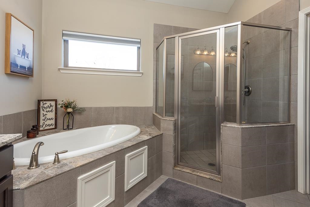 95 Chesnut Rdg Drive Oakland, TN 38060 - Photo 14 of 33 Full bath featuring a bath, a shower stall, and vanity