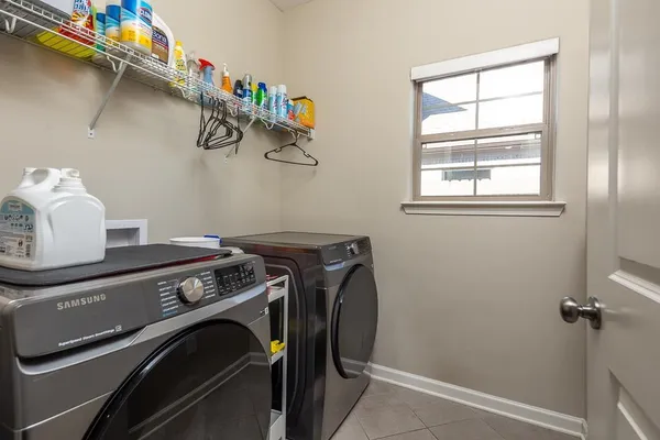 a utility room with dryer and washer