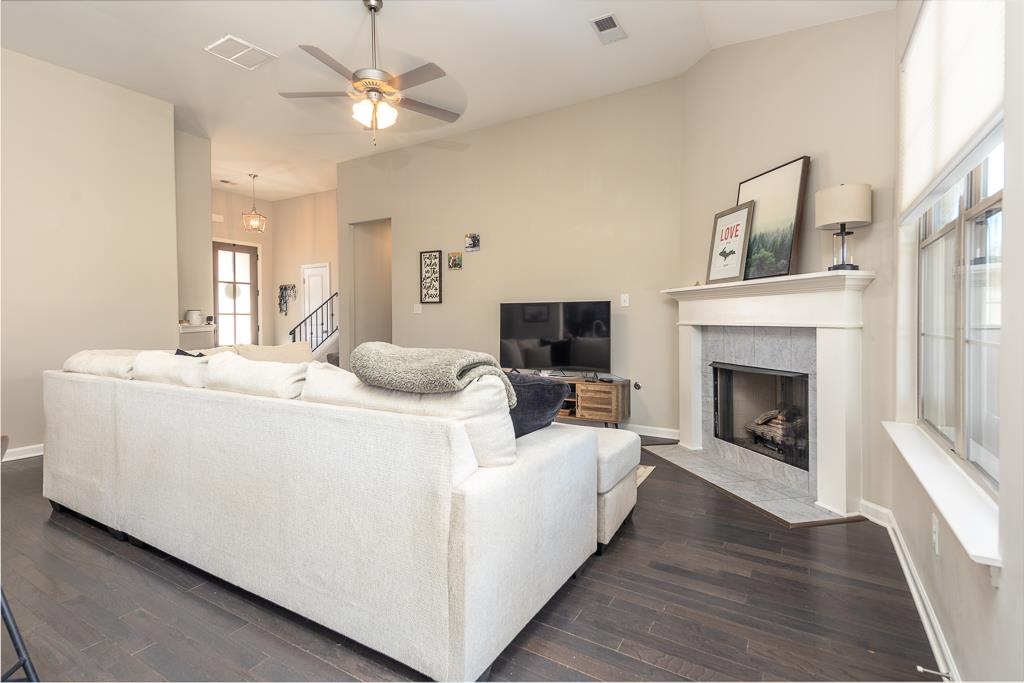 95 Chesnut Rdg Drive Oakland, TN 38060 - Photo 5 of 33 a living room with furniture a fireplace and a ceiling fan