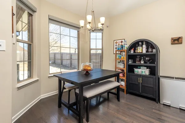 a kitchen with kitchen island granite countertop wooden cabinets and stainless steel appliances