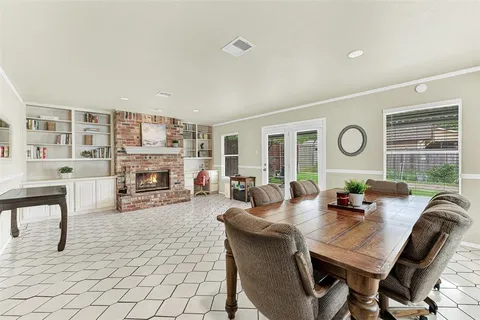 a living room with furniture large window and fireplace