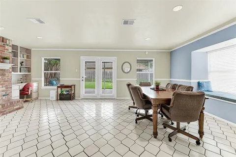 a view of a work space with furniture and window