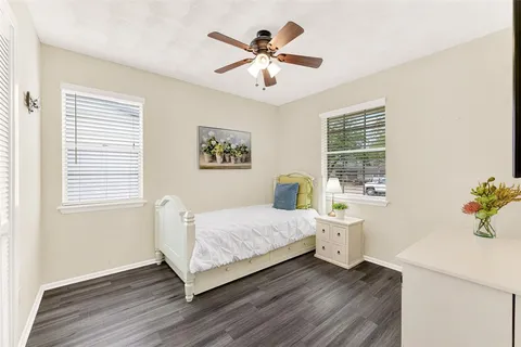 a living room with a bed and a window